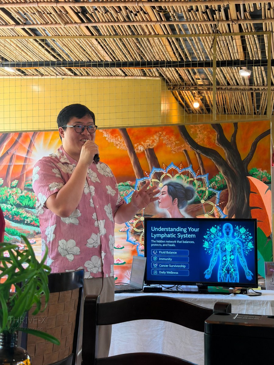 Adrian Lim, PTRP, CLT, founder of Thrive-X, presenting a talk on the lymphatic system
